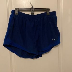 Blue Nike running shorts